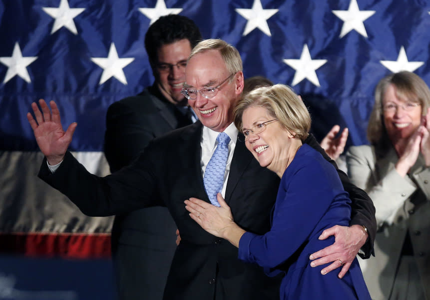 Elizabeth Warren celebrates with her husband, Bruce Mann, after winning her Senate race in November 2012. 