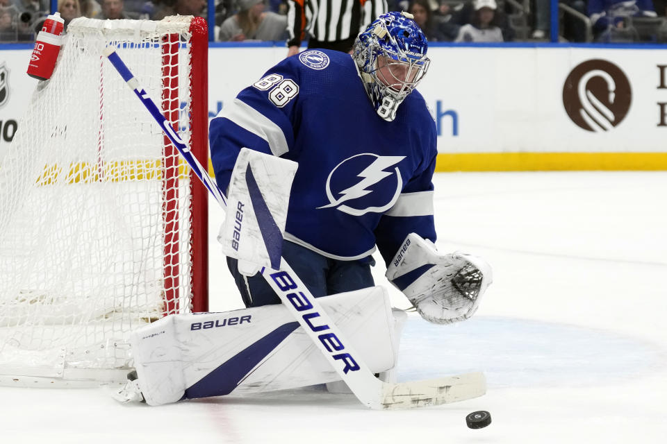 Tampa Bay Lightning goaltender Andrei Vasilevskiy (88) makes a save on a shot by the Anaheim Ducks during the third period of an NHL hockey game Saturday, Jan. 13, 2024, in Tampa, Fla. (AP Photo/Chris O'Meara)