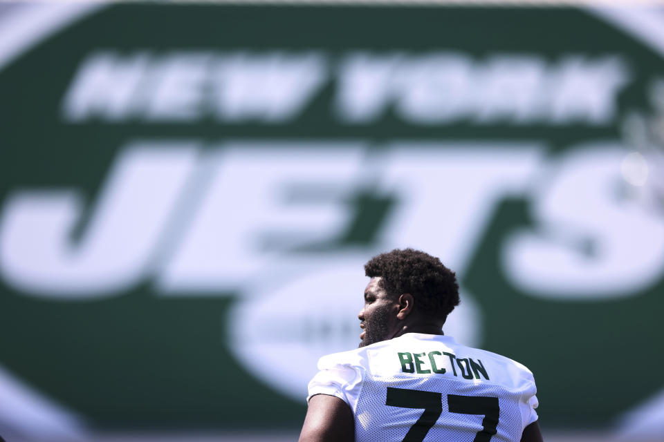 New York Jets offensive tackle Mekhi Becton (77) looks on during practice at the team's NFL football training facility, Saturday, July. 31, 2021, in Florham Park, N.J. (AP Photo/Rich Schultz)
