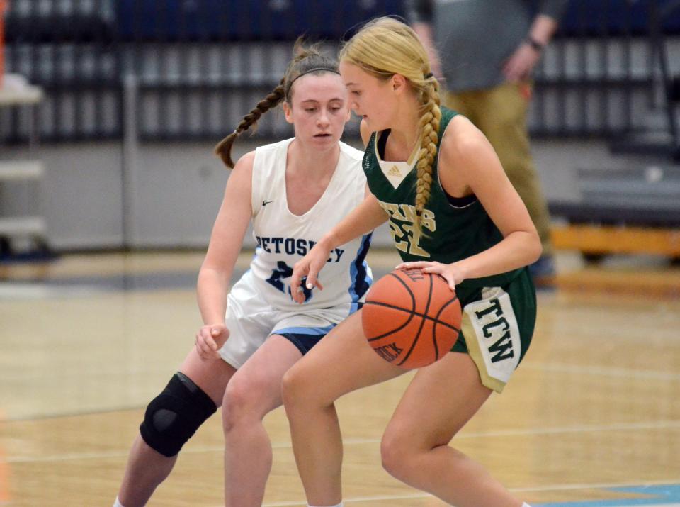 Petoskey's Haidyn Wegmann puts the pressure on a Traverse City West player with the ball Thursday.
