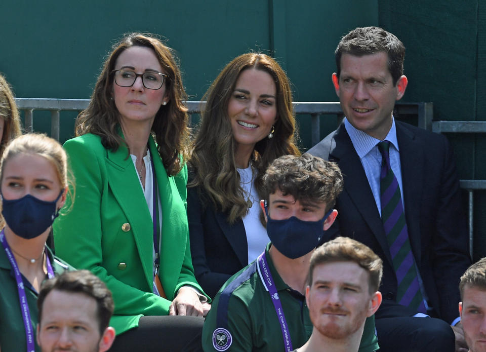 The Duchess of Cambridge and Tim Henman (right) attending day five of Wimbledon at The All England Lawn Tennis and Croquet Club, Wimbledon.