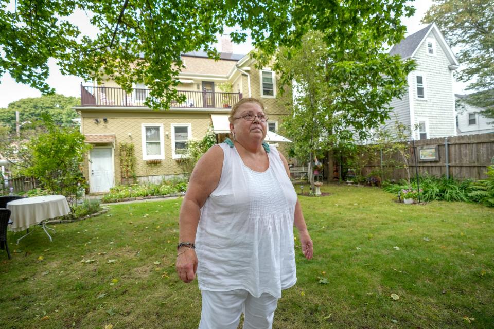 Linda Perri, president of Providence's Washington Park Neighborhood Association, in her backyard on Alabama Avenue. On some days, she said, the air quality is so bad she doesn't venture outside.