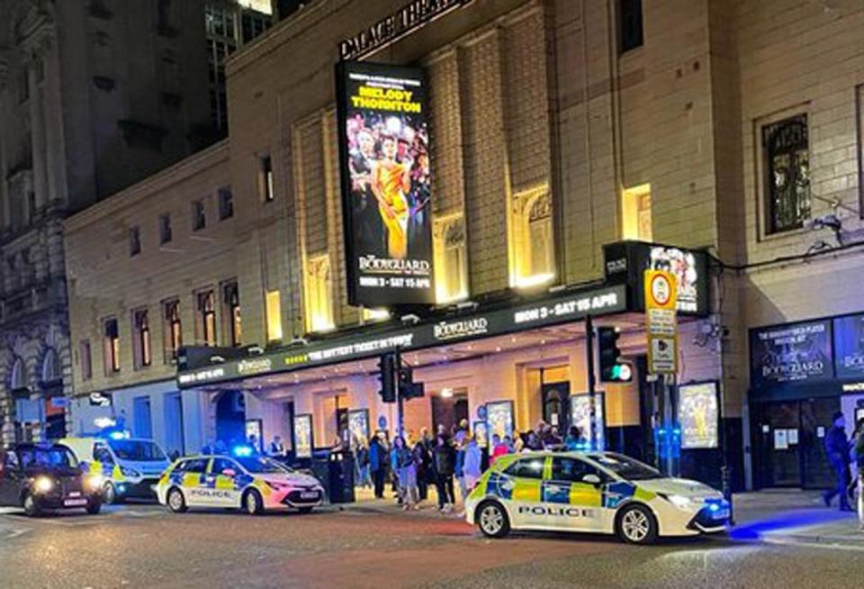 Police outside the Palace Theatre in Manchester after some members of the audience refused to remain seated and refrain from loudly singing (PA)