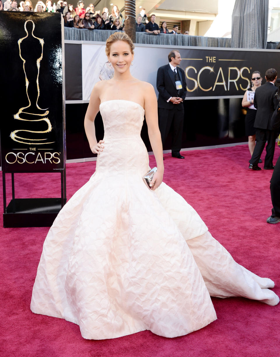 Jennifer wearing a long strapless white gown