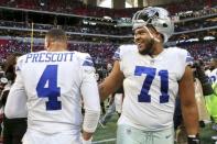 FILE PHOTO: Nov 18, 2018; Atlanta, GA, USA; Dallas Cowboys quarterback Dak Prescott (4) and offensive tackle La'el Collins (71) celebrate after a game against the Atlanta Falcons at Mercedes-Benz Stadium. Mandatory Credit: Brett Davis-USA TODAY Sports