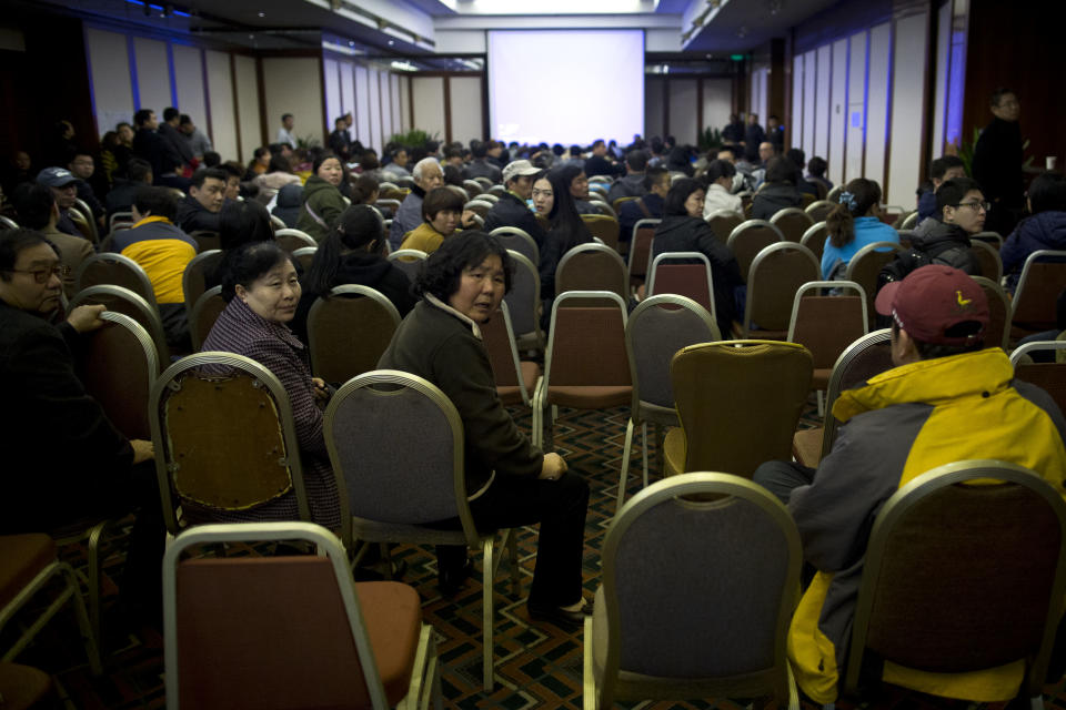 Relatives of Chinese passengers aboard missing Malaysia Airlines flight MH370 attend a daily briefing meeting with managers of Malaysia Airlines at a hotel ballroom in Beijing, China, Wednesday, March 19, 2014. Search crews from 26 countries are looking for Malaysia Airlines Flight 370, which vanished early March 8 with 239 people aboard en route from Kuala Lumpur to Beijing. Frustration is growing among relatives of those on the plane at the lack of progress in the search. (AP Photo/Alexander F. Yuan)