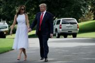 <p>The First Lady wore this subtly bohemian bridal Andrew Gin dress with a pair of red and white polka dot heels. In a rare display of public affection, the President and his wife left the White House for Orlando hand-in-hand back in June 2019.</p>