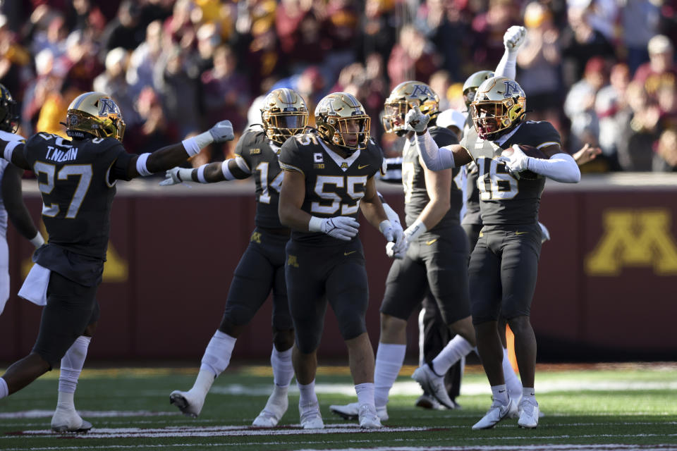 Minnesota defensive back Coney Durr (16) celebrates on the field after intercepting the ball during an NCAA college football game against Maryland, Saturday, Oct. 23, 2021, in Minneapolis. (AP Photo/Stacy Bengs)