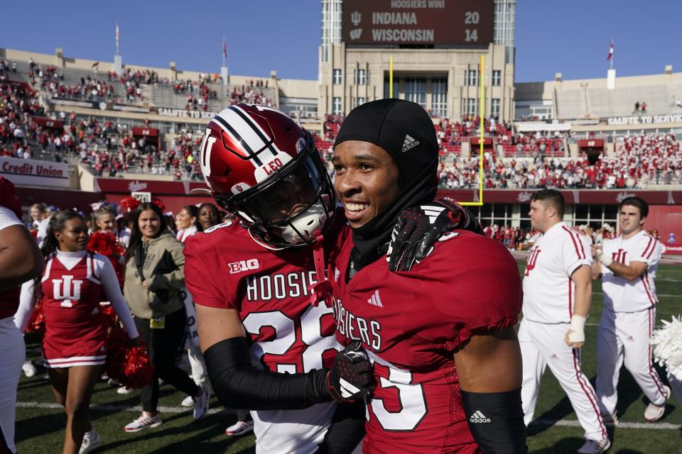 Indiana defensive back Jaz Boykin (28) and defensive back Jordan Shaw (23) celebrate after Indiana defeated Wisconsin in an NCAA college football game, Saturday, Nov. 4, 2023, in Bloomington, Ind. (AP Photo/Darron Cummings)