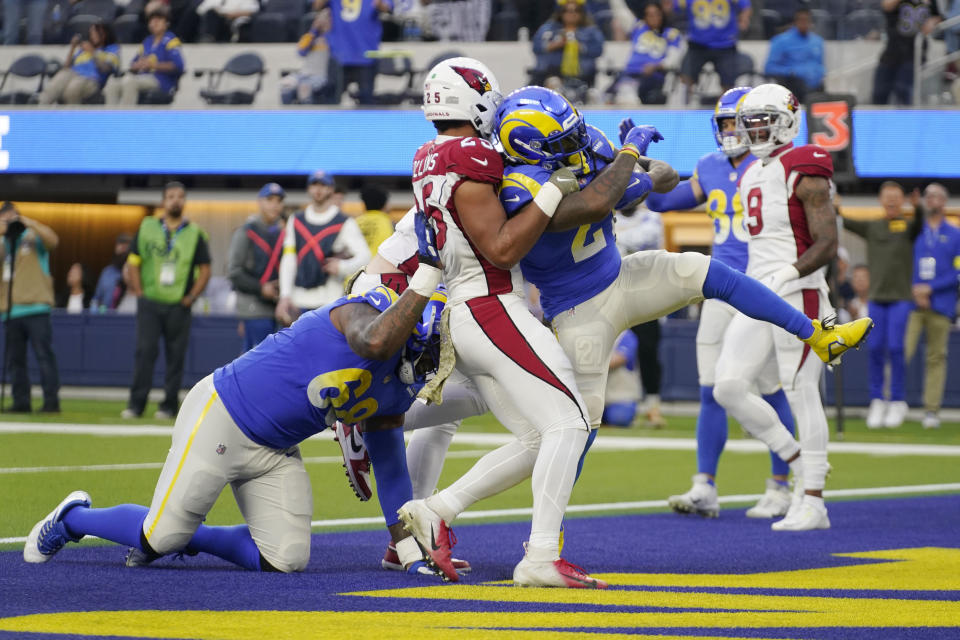 Los Angeles Rams running back Darrell Henderson Jr., center, scores a rushing touchdown during the second half of an NFL football game against the Arizona Cardinals Sunday, Nov. 13, 2022, in Inglewood, Calif. (AP Photo/Mark J. Terrill)