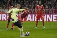 Manchester City's Erling Haaland shoots a penalty kick during the Champions League quarter final second leg soccer match between Bayern Munich and Manchester City, at the Allianz Arena stadium in Munich, Germany, Wednesday, April 19, 2023. (AP Photo/Matthias Schrader)