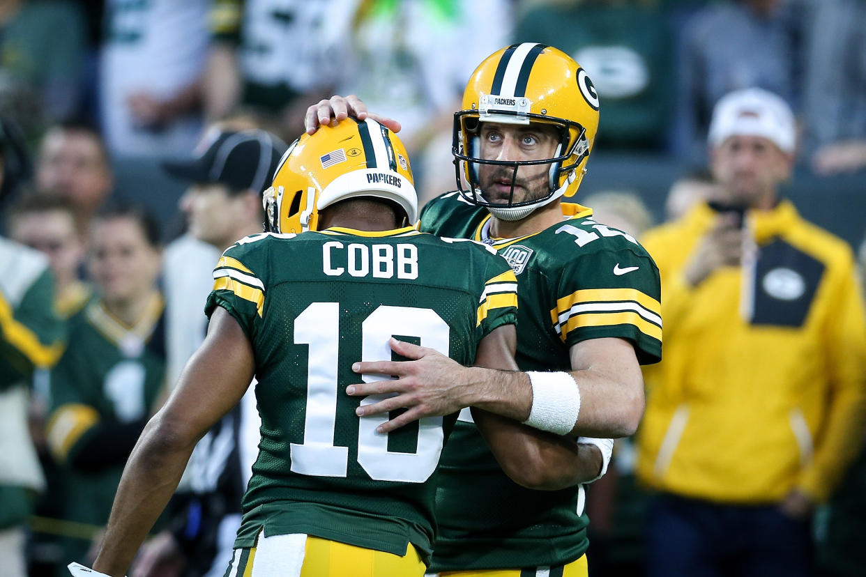 GREEN BAY, WI - SEPTEMBER 09:  Randall Cobb #18 and Aaron Rodgers #12 of the Green Bay Packers meet before the game against the Chicago Bears at Lambeau Field on September 9, 2018 in Green Bay, Wisconsin. (Photo by Dylan Buell/Getty Images)