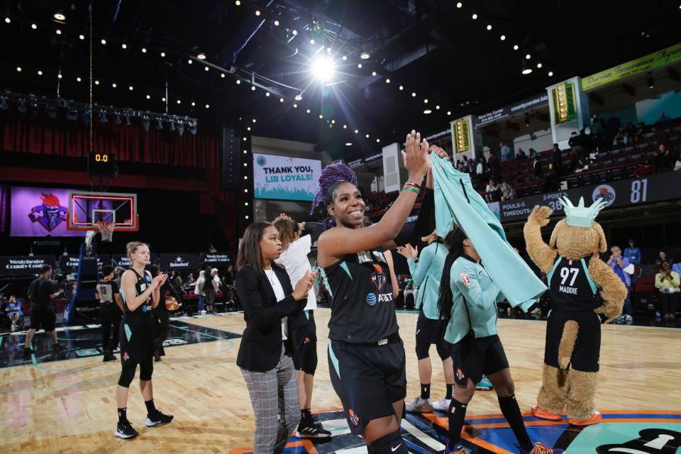 New York Liberty players wave to fans after a 2019 game at the Westchester County Center.