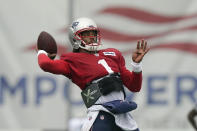 New England Patriots quarterback Cam Newton winds up for a pass during an NFL football practice, Thursday, Aug. 5, 2021, in Foxborough, Mass. (AP Photo/Steven Senne)