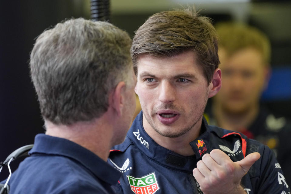 Red Bull driver Max Verstappen of the Netherlands, right, talks to Red Bull team principal Christian Horner during Formula One pre season testings at the Bahrain International Circuit in Sakhir, Bahrain, Friday, Feb. 23, 2024. (AP Photo/Darko Bandic)