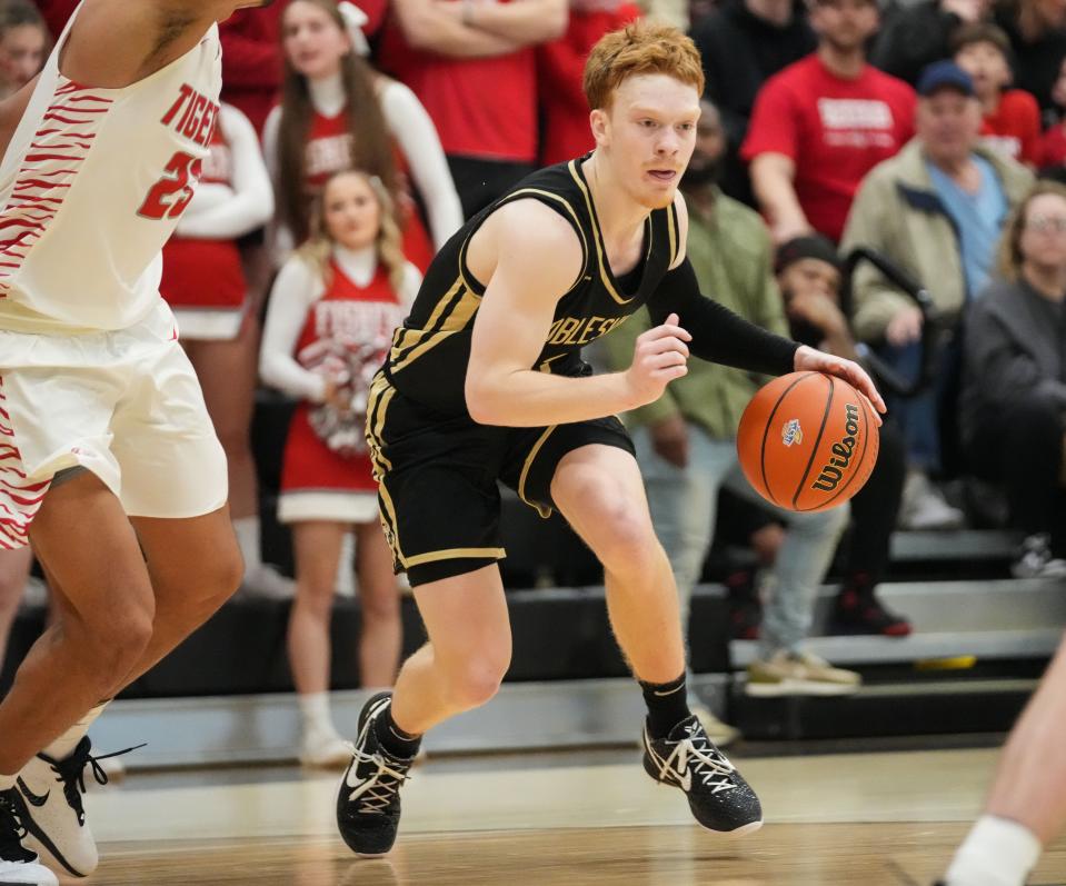 Noblesville Millers guard Aaron Fine (3) rushes after the ball Saturday, March 2, 2024, during the Class 4A sectional final at Noblesville High School in Noblesville. The Fishers Tigers defeated the Noblesville Millers, 49-47.
