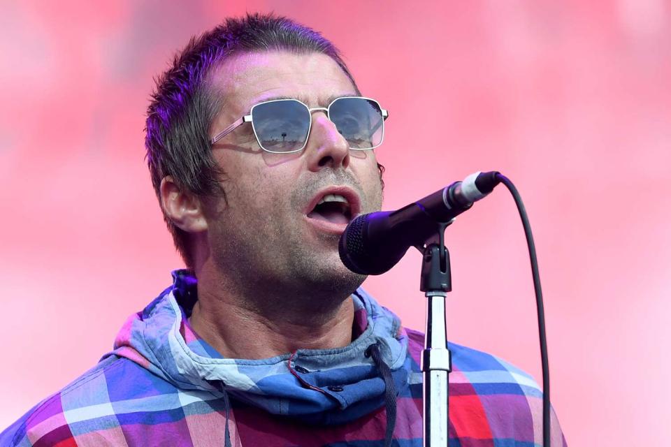 <p>Dave J Hogan/Getty</p> Liam Gallagher performs in Glastonbury in June 2019