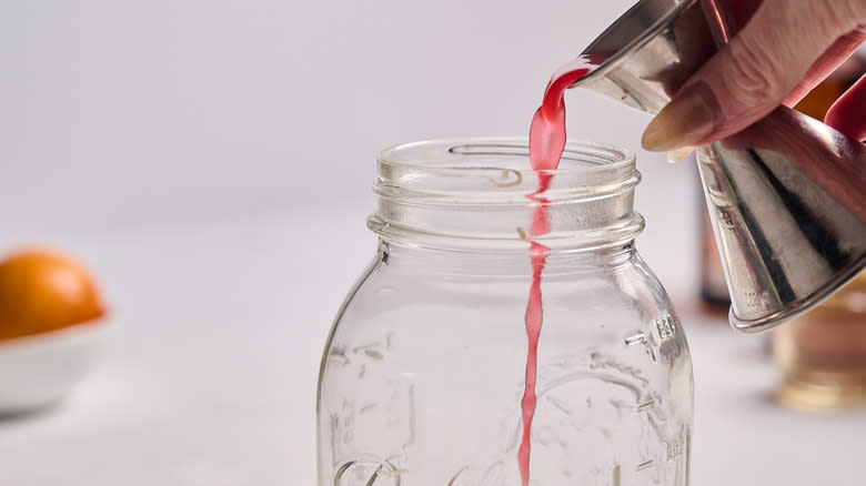 pouring juice into shaker