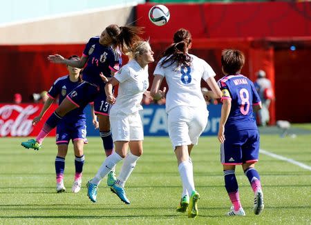 Jul 1, 2015; Edmonton, Alberta, CAN; Japan midfielder Rumi Utsugi (13) and England midfielder Katie Chapman (16) go for a head ball during the second half in the semifinals of the FIFA 2015 Women's World Cup at Commonwealth Stadium. Mandatory Credit: Erich Schlegel-USA TODAY Sports