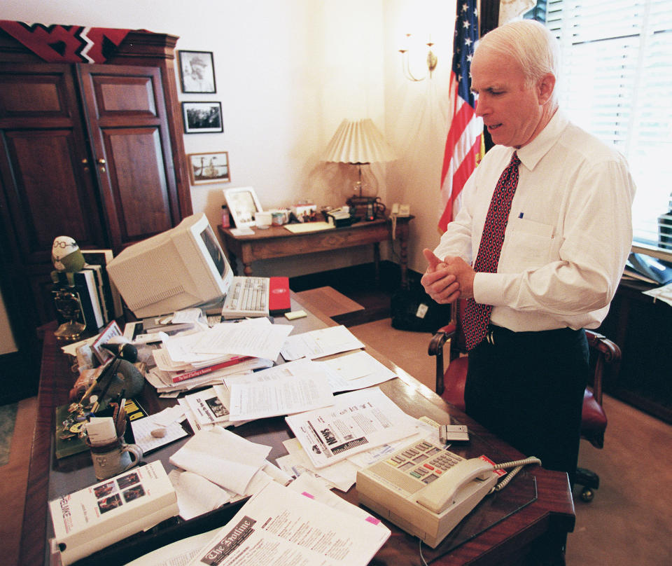 McCain talks to his wife on the speaker phone in his Senate office.