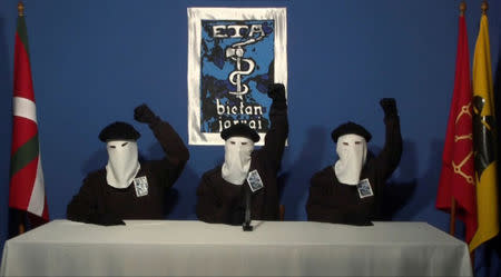 FILE PHOTO: Three members of Basque separatist group ETA call for a definitive end to 50 years of armed struggle, which has cost the lives of at least 850 people, in this still image taken from an undated video published on the website of Basque language newspaper Gara October 20, 2011. REUTERS/Gara/Handout/File Photo