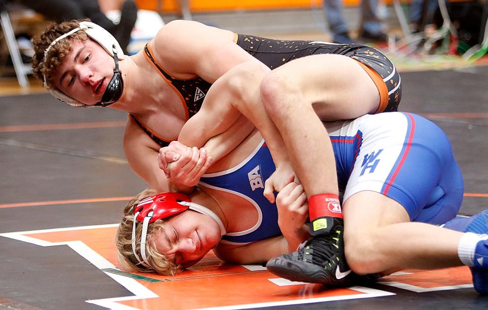 Ashland's Angelo Seitz wrestles West Holmes' Hunter Eberhard during the OCC wrestling championships on Saturday, Feb 19, 2022 at Ashland High School. TOM E. PUSKAR/TIMES-GAZETTE.COM