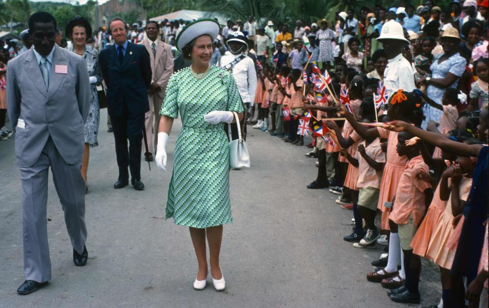 <p>Even all the way back in the 70s The Queen was rocking numerous retro green prints. [Photo: Getty] </p>