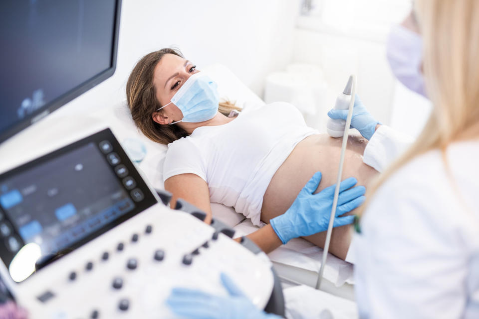 A woman getting an ultrasound at the doctor's office