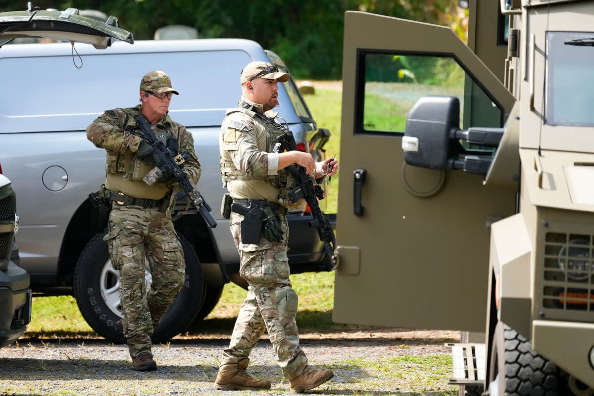 Law enforcement officers gather as they search for escaped convict Danelo Cavalcante in Glenmoore, Pa (Copyright 2023 The Associated Press. All rights reserved.)