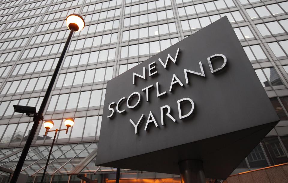 New Scotland Yard police headquarters is seen in London January 27, 2011. British police opened a new investigation on Wednesday into allegations of phone hacking after the country's top-selling tabloid newspaper sacked one of its senior editors.  REUTERS/Suzanne Plunkett (BRITAIN - Tags: SOCIETY POLITICS CRIME LAW CITYSCAPE)