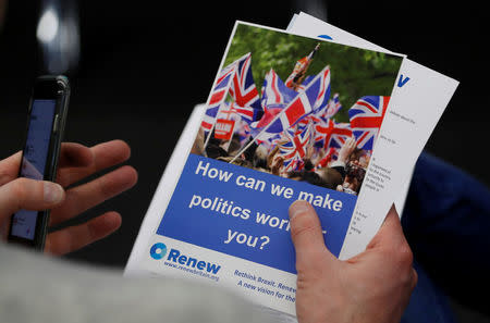 A journalist reads literature produced by the Renew party at press conference in London, Britain, February 19, 2018. REUTERS/Peter Nicholls