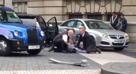 A man is being arrested by police near the Natural History Museum, in London, Britain, in this still image from a video taken October 7, 2017, obtained from social media. Twitter/ @RosaRodaNews/via REUTERS ATTENTION EDITORS - THIS IMAGE HAS BEEN SUPPLIED BY A THIRD PARTY. YOUR ATTENTION IS DRAWN TO THE RESTRICTIONS IN THE USE OF THIS VIDEO. MANDATORY CREDIT. NO RESALES. NO ARCHIVES. MUST ON SCREEN COURTESY TWITTER/ @RosaRodaNews. NO NEWS USES AFTER NOVEMBER 6, 2017 23:59:59.