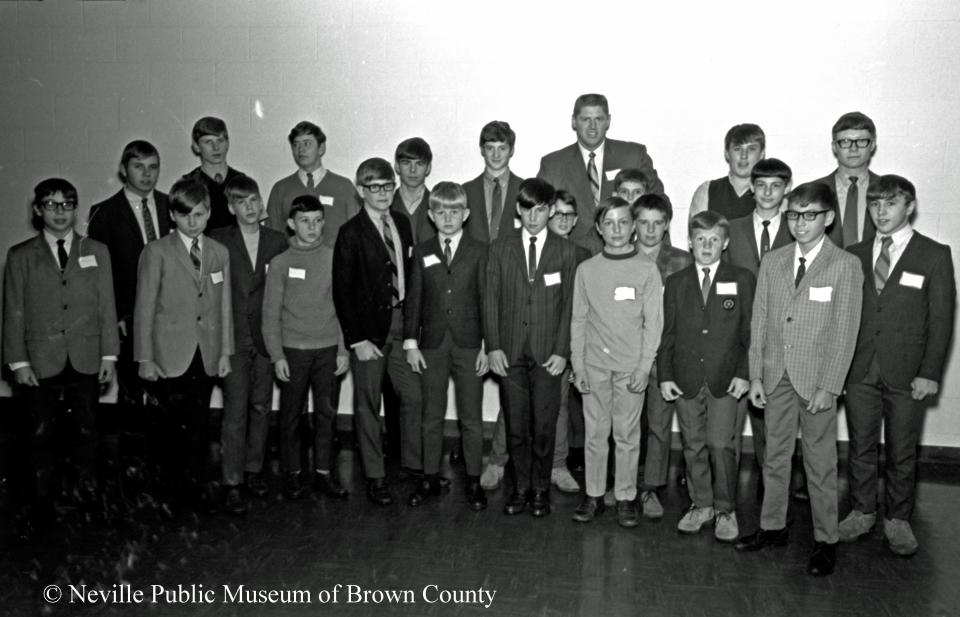 Washington Senators outfielder and first baseman Frank Howard poses with Little Leaguers after speaking at the 1970 Nicolet Paper Co. athletic banquet in Green Bay. Howard settled in the area when he was signed by the Dodgers in 1958 and played through September with their Green Bay team in the Class B Three-I League. He played for the Dodgers until 1964 and for the Senators until 1971. After spending the offseason in the Green Bay area for many years, he resettled in northern Virginia in the 1990s.