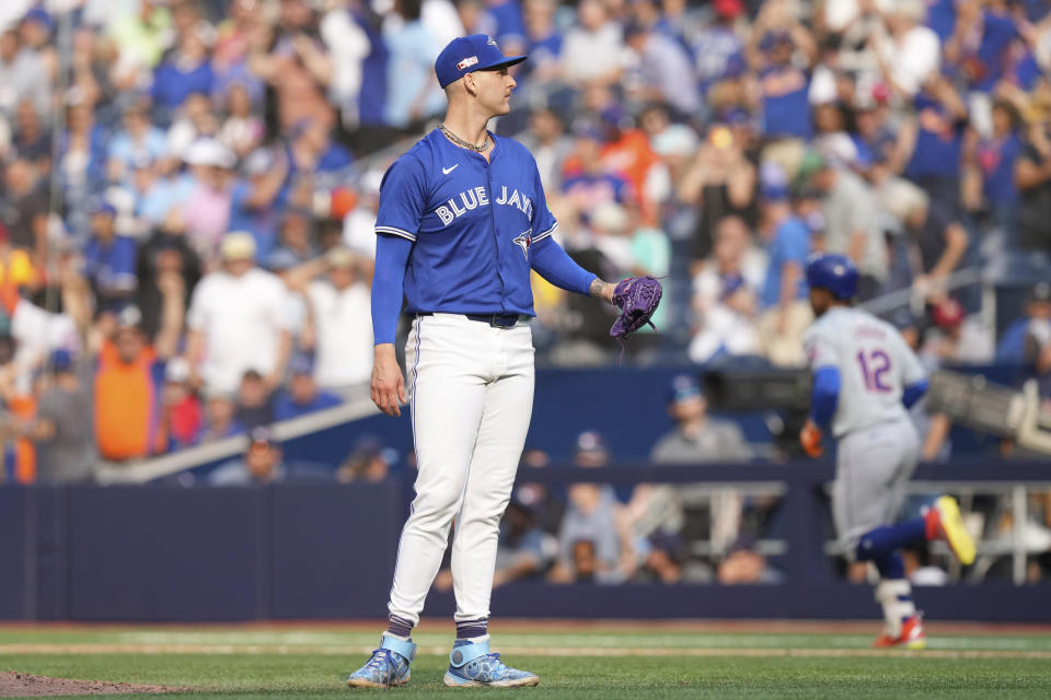 Toronto Blue Jays pitcher Bowden Francis stands on the mound after New York Mets' Francisco Lindor hit a solo home run in the ninth inning of a baseball game in Toronto, Wednesday, Sept. 11, 2024. (Chris Young/The Canadian Press via AP)