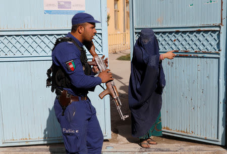 An Afghan woman arrives at a polling station to cast her vote during parliamentary elections in Kabul, Afghanistan, October 20, 2018. REUTERS/Mohammad Ismail