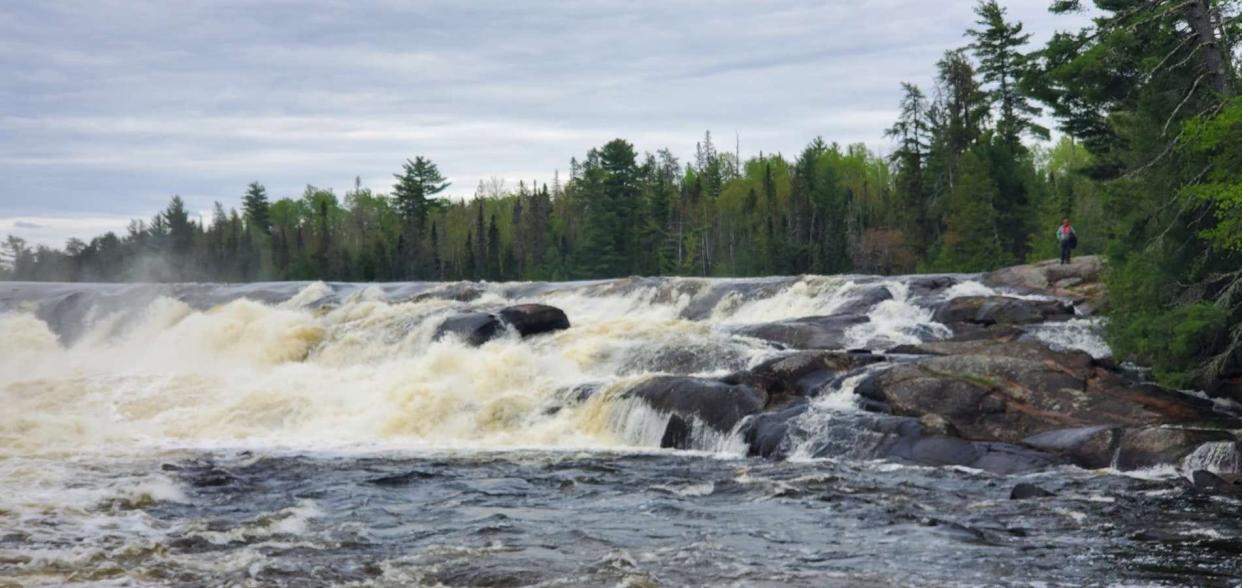 Two canoes carrying four individuals went over Curtain Falls in the Boundary Waters Area on May 18, 2024.