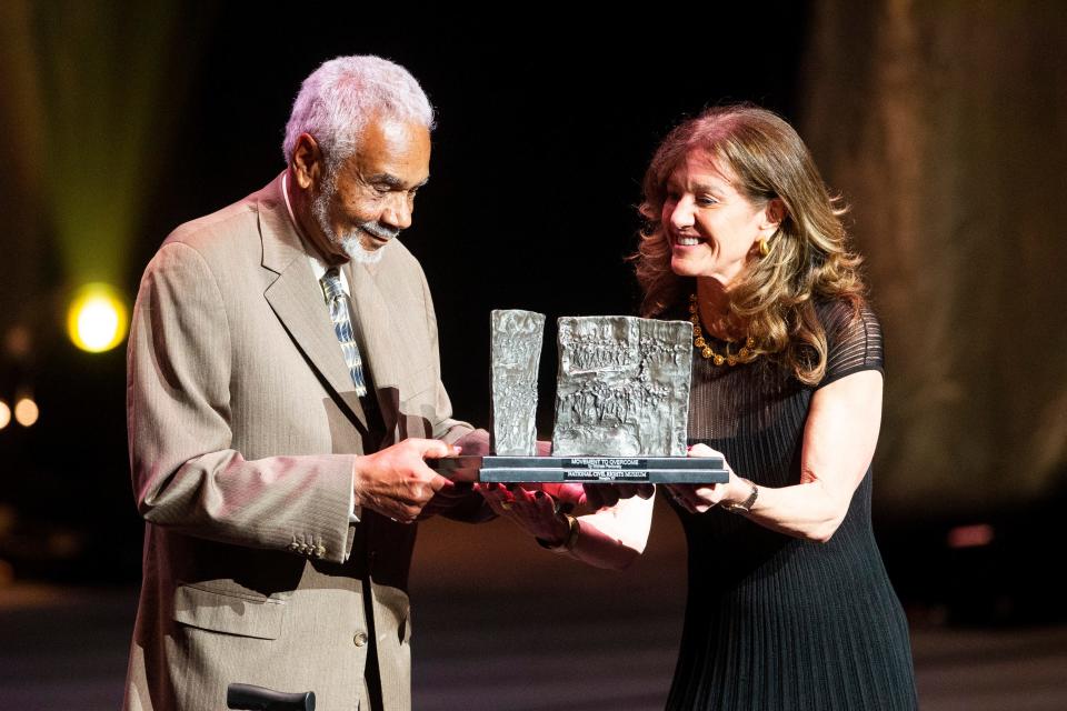 Clayborne Carson is presented the Freedom Award by Barbara Hyde, CEO of the Hyde Family Foundation, during the Freedom Award ceremony at The Orpheum in Downtown Memphis, on Thursday, October 19, 2023.