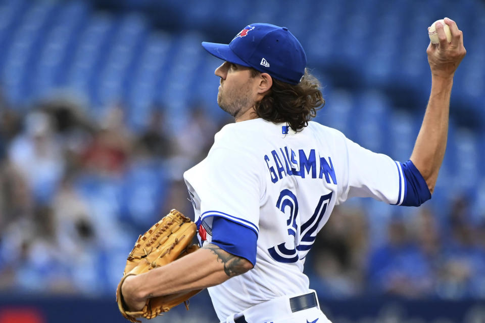 Toronto Blue Jays starting pitcher Kevin Gausman throws to a Kansas City Royals batter during the first inning of a baseball game Thursday, July 14, 2022, in Toronto. (Jon Blacker/The Canadian Press via AP)