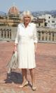 <p>In Florence, Italy Camilla posed in Palazzo Pitti wearing this dropwaist buttercream dress with two-toned pumps for an event for the Italian Wool Industry.</p>