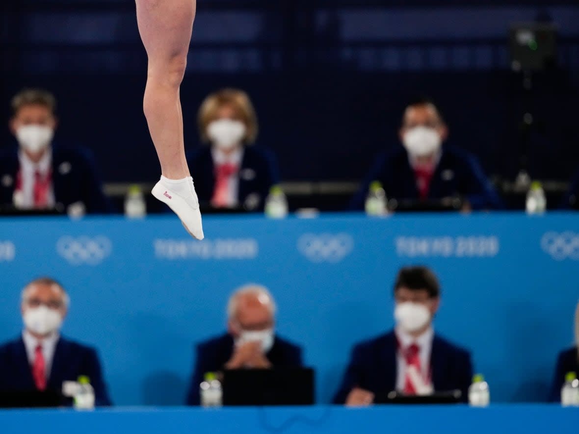 A Toronto man has been charged with multiple sexual offences related to his time coaching gymnastics in both Ottawa and Kingston, Ont. (Ashley Landis/The Associated Press - image credit)