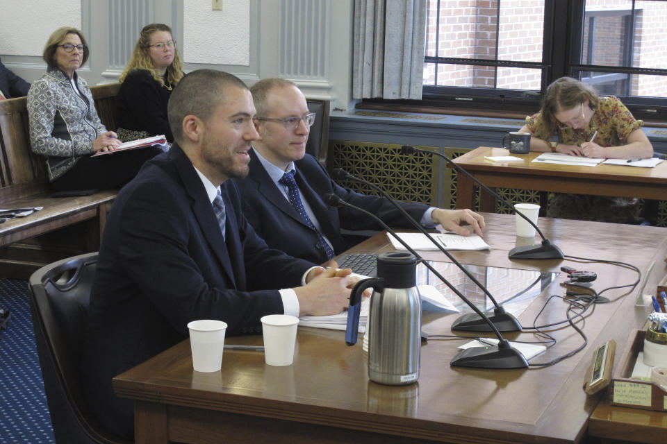 Dan Stickel, chief economist with the Alaska Department of Revenue's tax division, left at table, speaks to the Senate Finance Committee as part of a presentation on the major North Slope oil project known as the Willow project on Thursday, March 23, 2023, in Juneau, Alaska. Seated next to Stickel is Owen Stephens with the tax division. (AP Photo/Becky Bohrer)