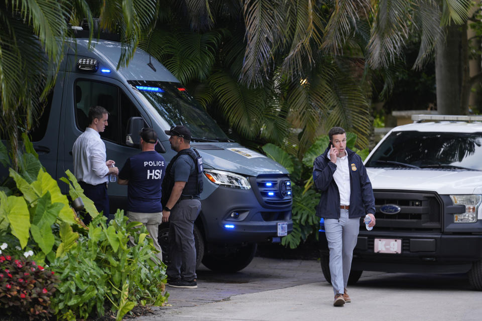 Law enforcement agents stand at the entrance to a property belonging to rapper Sean "Diddy" Combs, Monday, March 25, 2024, on Star Island in Miami Beach, Fla. Two properties belonging to Combs in Los Angeles and Miami were searched by federal Homeland Security Investigations agents and other law enforcement as part of an ongoing sex trafficking investigation by federal authorities in New York, two officials told The Associated Press. (AP Photo/Rebecca Blackwell)