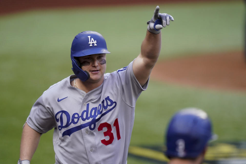 Los Angeles Dodgers' Joc Pederson celebrates a three-run home run during the first inning in Game 3 of a baseball National League Championship Series against the Atlanta Braves Wednesday, Oct. 14, 2020, in Arlington, Texas. (AP Photo/Eric Gay)