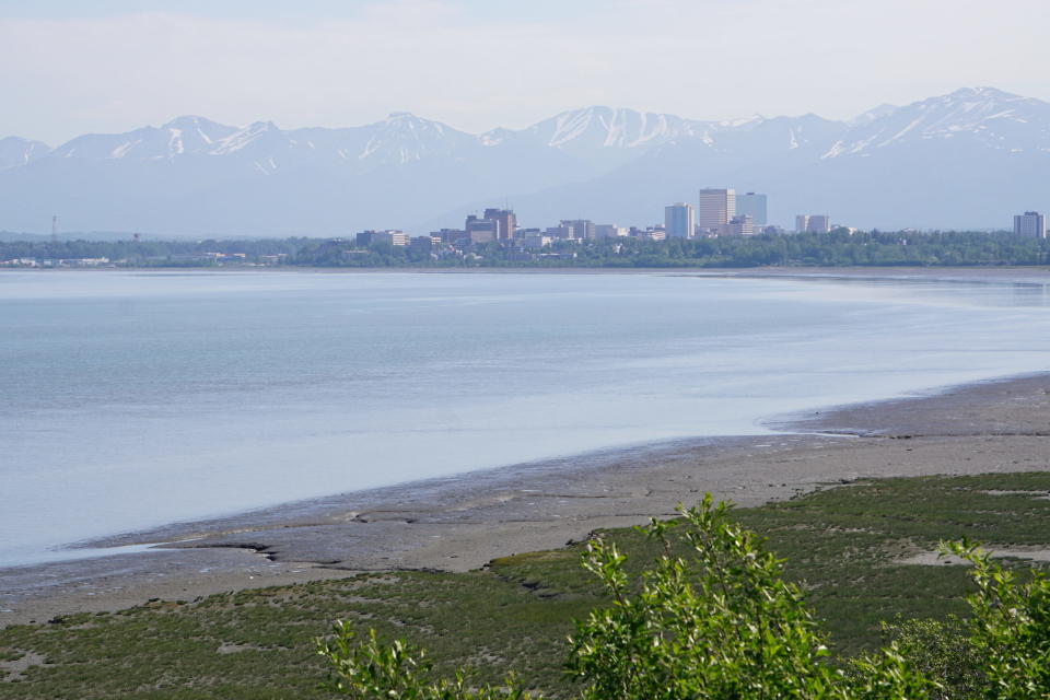 The downtown Anchorage skyline is seen from the Tony Knowles Coastal Trial on June 3, 2022. Although Anchorage is Alaska's largest city, it and the surrounding Southcentral region are considered small and isolated natural-gas markets. (Photo by Yereth Rosen/Alaska Beacon)