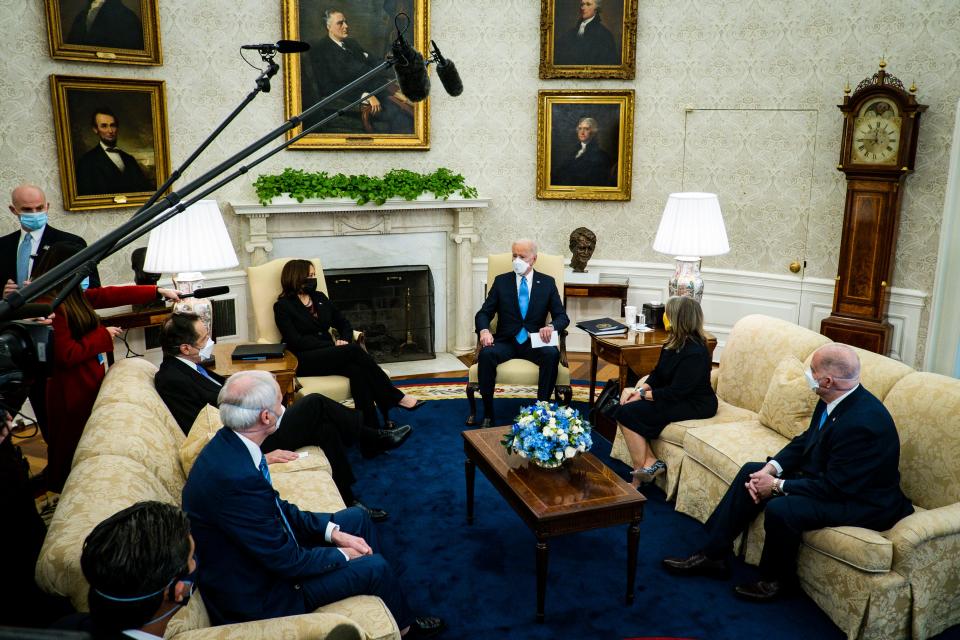 President Joe Biden and Vice President Kamala Harris meet with governors and mayors, including Gov. Andrew Cuomo, D-N.Y., Gov. Asa Hutchinson, R-Ark., Gov. Michelle Lujan Grisham, D-N.M., and Gov. Larry Hogan, R-Md., in the Oval Office on Feb. 12, 2021, to discuss the American Rescue Plan.