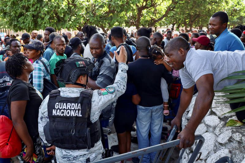 Migrants gather to regularize their migratory situation in COMAR, in Tapachula