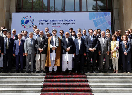 Afghan President Ashraf Ghani (C) poses for a group photo during a peace and security cooperation conference in Kabul, Afghanistan June 6, 2017. REUTERS/Omar Sobhani