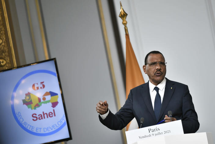 Niger's President Mohamed Bazoum delivers a speech after a video summit with leaders of G5 Sahel countries at the Elysee presidential Palace in Paris, Friday July 9, 2021. French President Emmanuel Macron said Friday his country will withdraw more than 2,000 troops from an anti-extremism force in Africa's Sahel region starting in the coming months. Macron announced last month a future reduction of France's military presence, arguing that the current operation is no longer adapted to the need. (Stephane de Sakutin, Pool photo via AP)