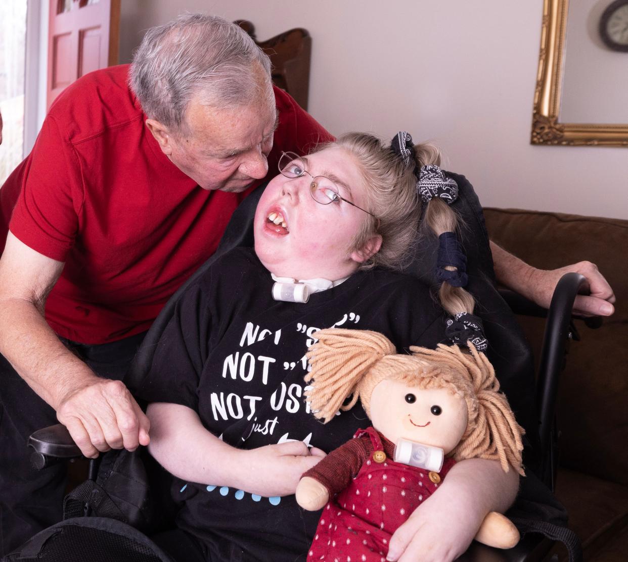 Marvin Penrod talks to Marissa Anderegg, 20, in their Jackson Township home. Marvin and Lori Penrod were granted guardianship of Marissa in 2015.