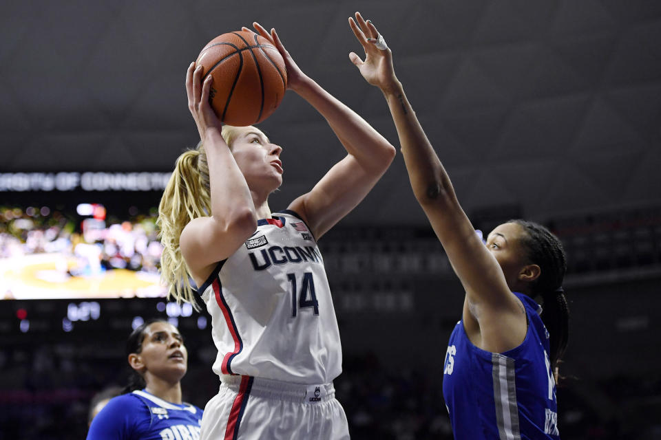 Connecticut's Dorka Juhász goes up for a basket against Seton Hall's Mya Bembry in the first half of an NCAA college basketball game, Friday, Jan. 21, 2022, in Storrs, Conn. (AP Photo/Jessica Hill)